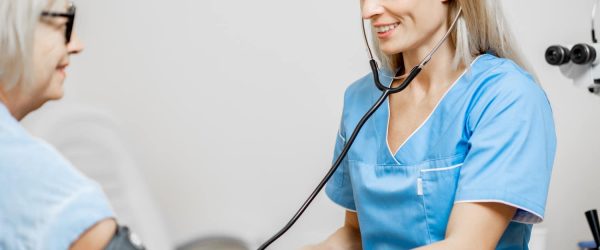Nurse measuring blood pressure of a senior patient Nurse measuring blood pressure of a senior patient